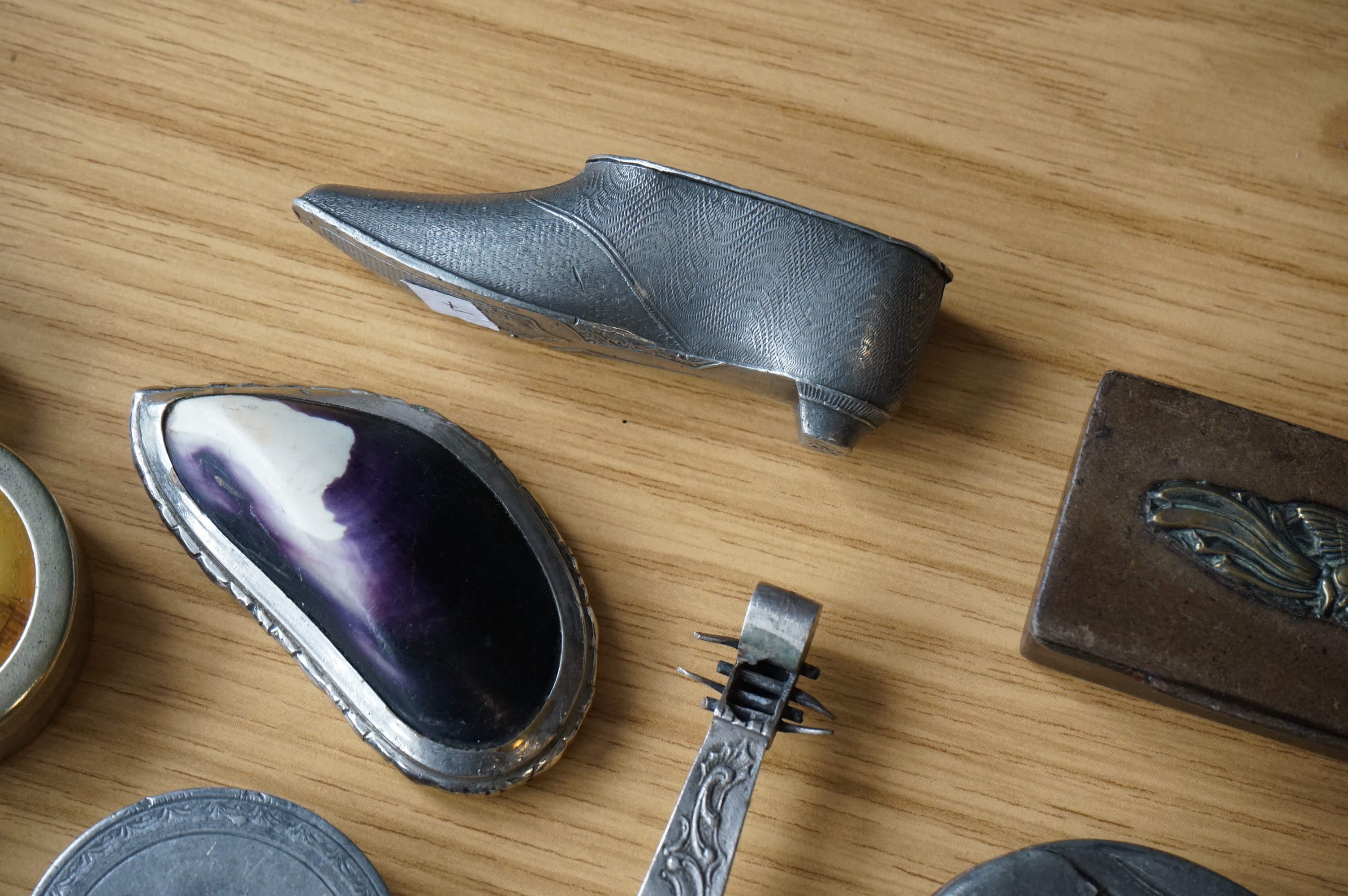 A collection of mixed metal stuff boxes including a novelty cello shaped box being 12cm long